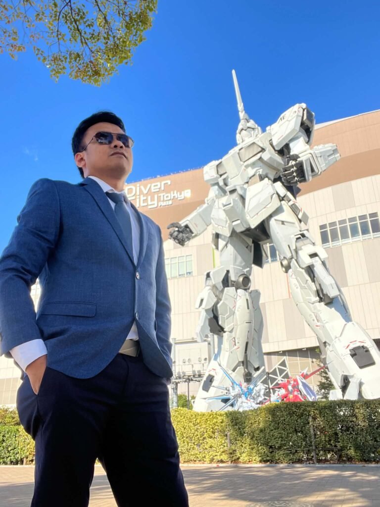 Traveler at the giant Gundam statue in Japan
