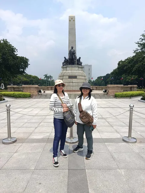 Travelers at the Rizal Monument, Luneta Park, Manila