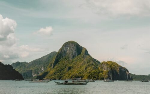 Boats near limestone islands in El Nido