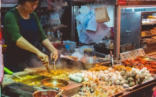 Street food vendor cooking in Hong Kong